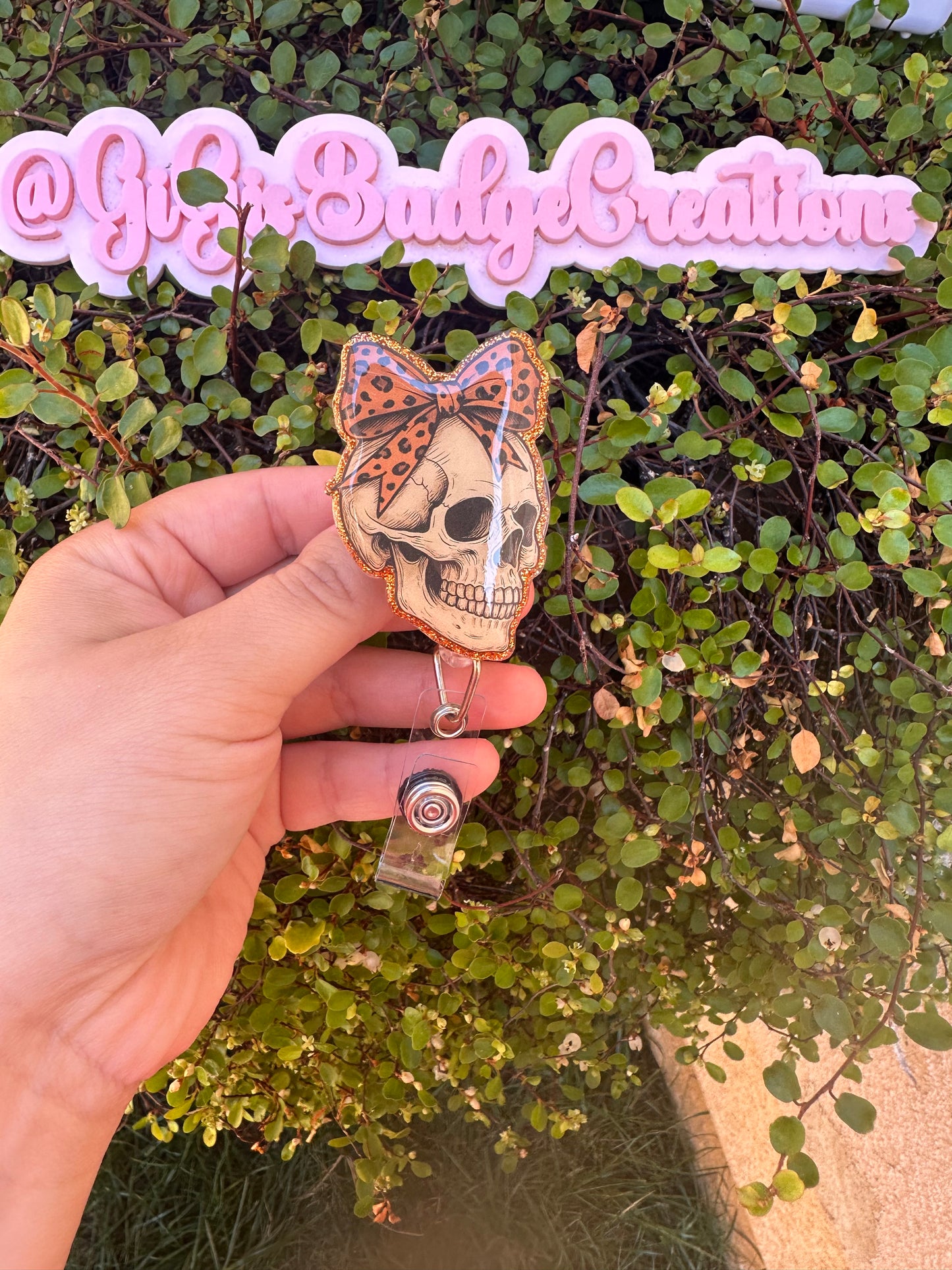 Skull w. Orange Bow Badge Reel