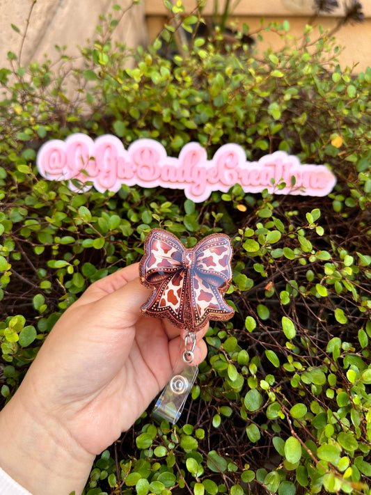 Brown Cow Bow Badge Reel