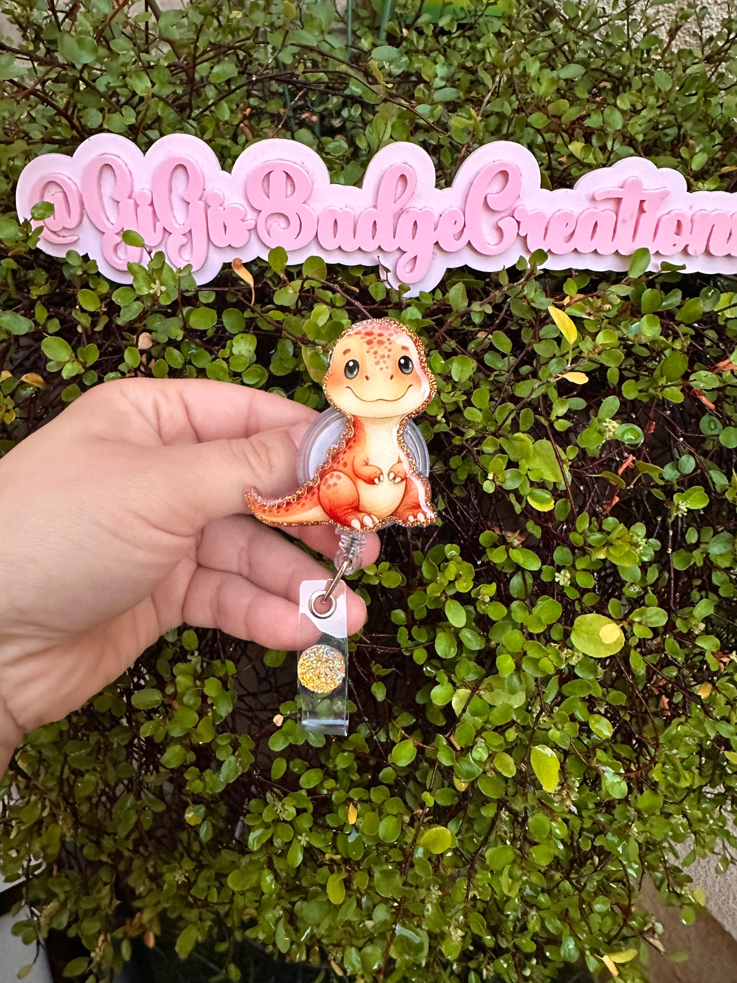 Orange Dino Badge Reel