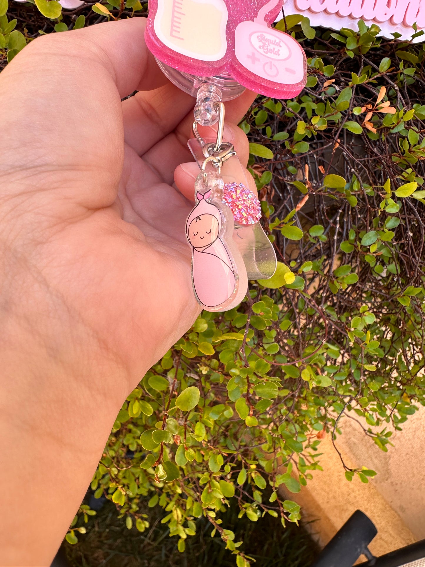 Liquid Gold with Baby Girl Charm Badge Reel